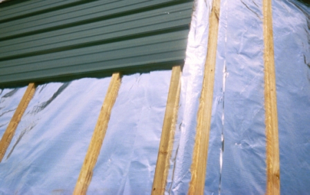 Reflective insulation on a metal building