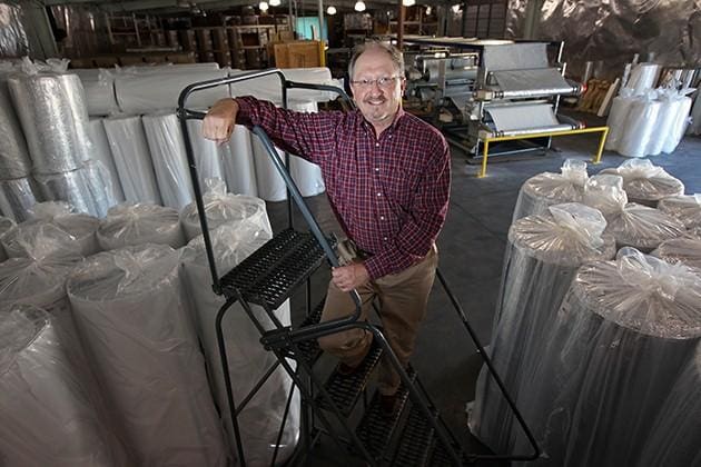 Bill Lippy standing on a ladder