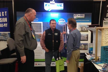 3 men at trade show